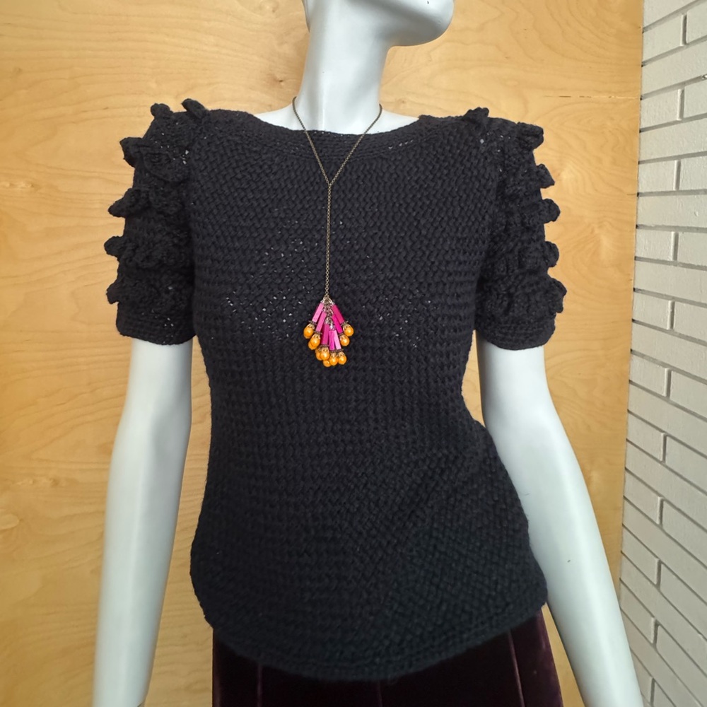 Exquisite black sweater with frills